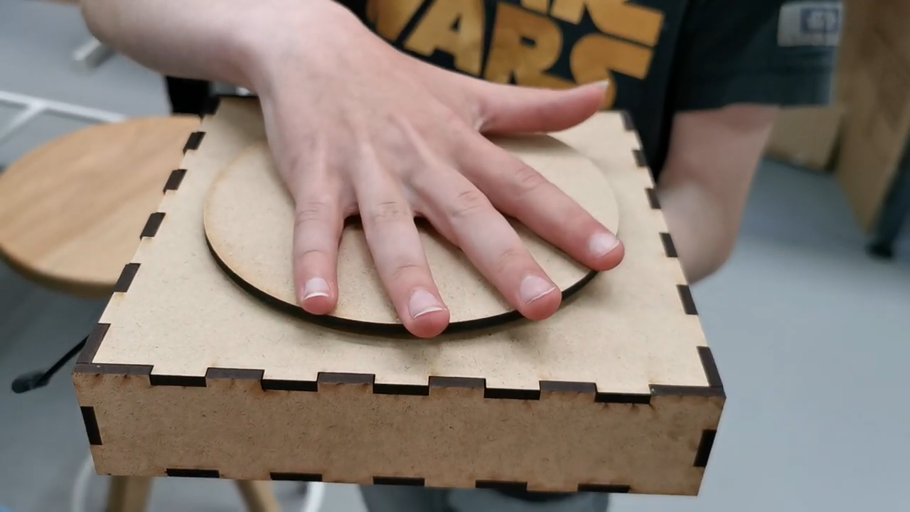 Wooden programmable keyboard held in one hand