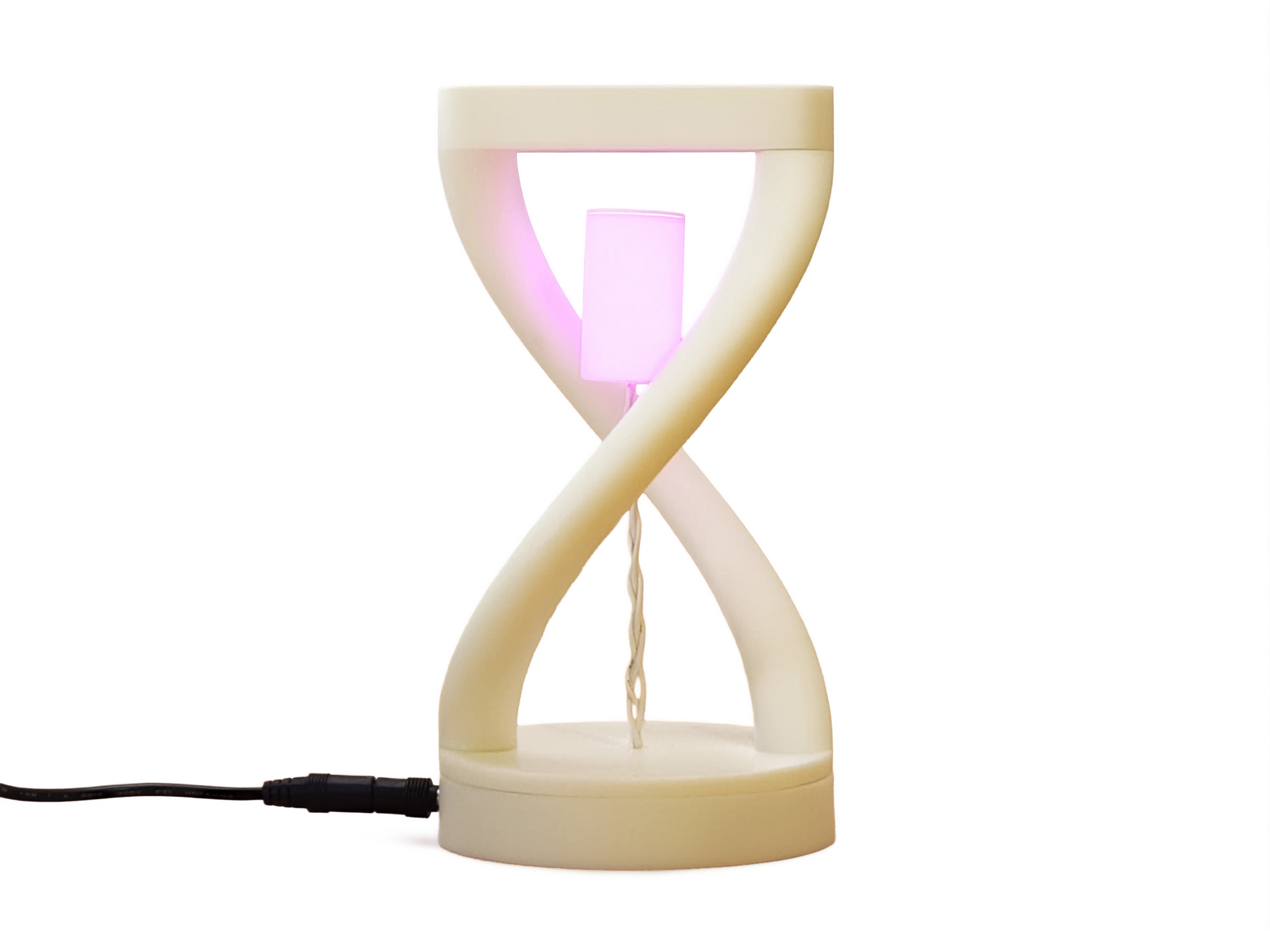 The Levitating Lamp glowing between its curved white supports
